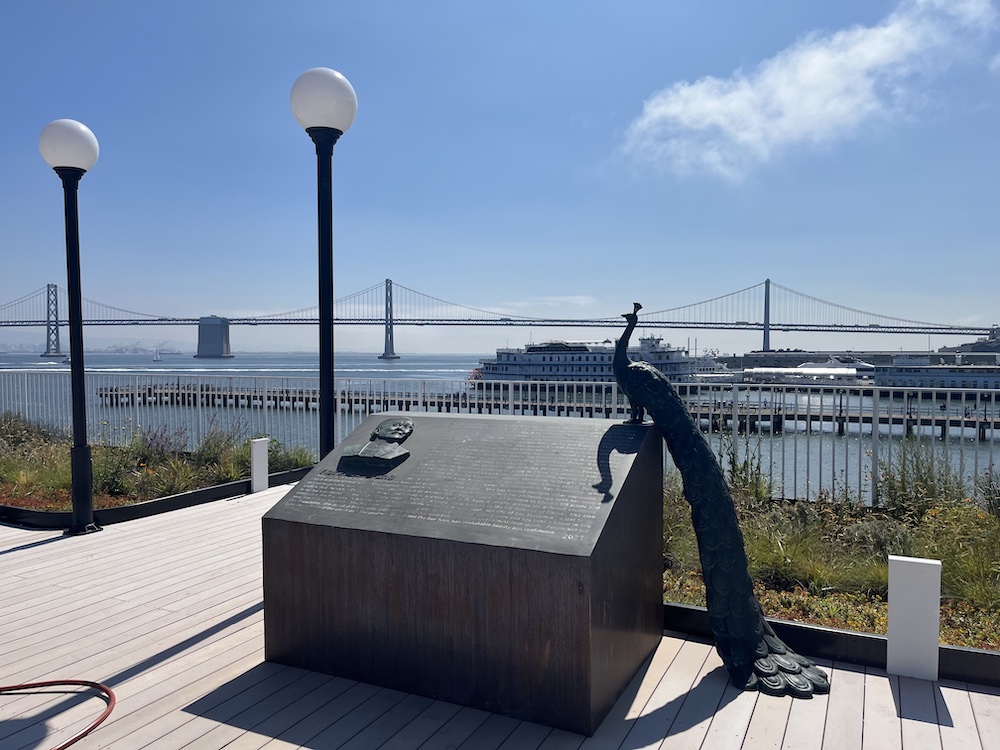 roof deck with peacock statue and bay bridge